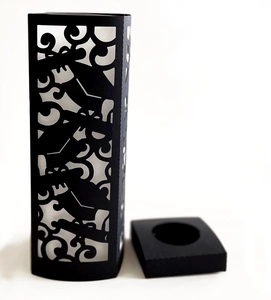Detail of black laser-cut lampshade with bat patterns for Halloween candle holder decor