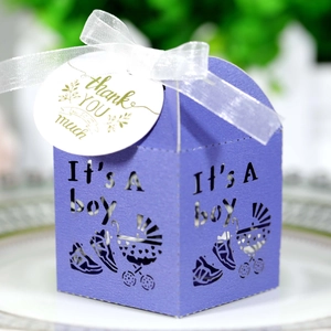 Detail of purple baby carriage laser-cut favor box with ribbon and thank you tag