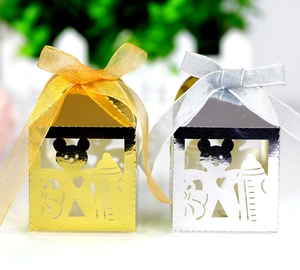 Laser cut baby shower gift boxes in gold and silver with ribbon and hollow baby pattern