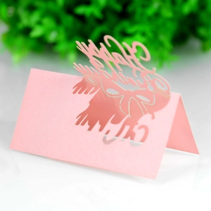 Detailed laser-cut Happy Birthday lettering on pink pearlescent paper place card
