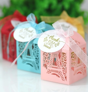 Detailed laser-cut Eiffel Tower favor box with ribbon and a thank you gift tag