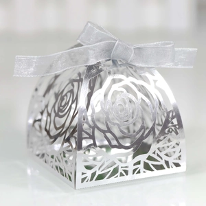 Detailed laser-cut silver rose pattern gift box with elegant satin ribbon bow