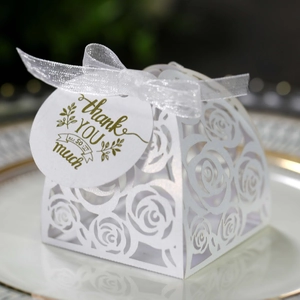 Detail of white laser-cut rose gift box with organza ribbon and Thank You tag