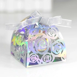 Laser cut rose wedding candy box with iridescent finish and silver ribbon bow decor