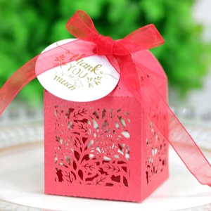 Close-up of red hollowed-out rose candy gift box with ribbon and Thank You tag