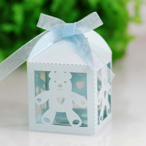 Detail view of light blue teddy bear hollow gift box with satin ribbon bow for candy