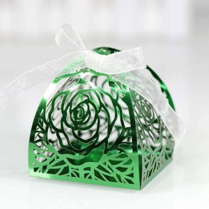 Laser-cut green metallic wedding favor box with rose pattern and white ribbon bow