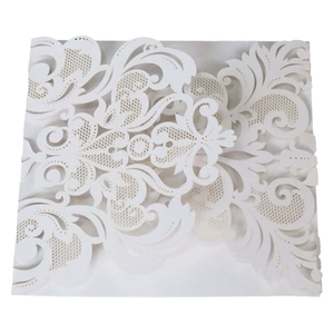 Elegant white laser-cut wedding invitation cover with intricate floral patterns