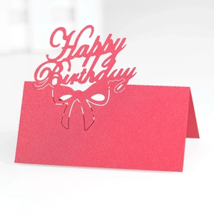 Detailed laser-cut Happy Birthday seating card in red paper with bow design