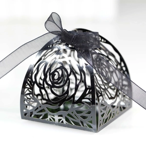 Elegant black laser-cut rose gift box with a matching ribbon bow on white background