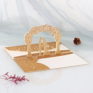 Detail of 3D pop-up rose card with glitter gold wedding silhouette and hollow pattern