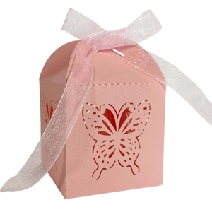 Detailed view of pink laser-cut butterfly gift box with elegant ribbon tie