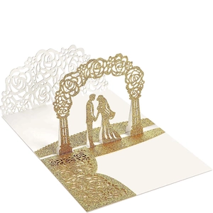 Macro detail of laser-cut rose patterns and glitter 3D pop-up wedding invitation card