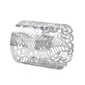 Detailed view of silver hollowed leaf and floral pattern on metal napkin ring buckle
