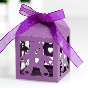 Detailed view of purple hollow bear paper candy box with satin ribbon bow for gift wrapping