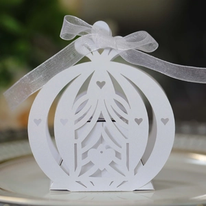Detailed view of hollowed heart carriage gift box with elegant white ribbon and bow