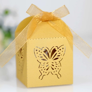 Detailed laser-cut butterfly gift box with golden ribbon and pearl paper texture