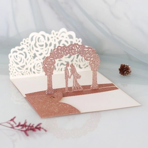 Macro view of rose gold glitter laser cut 3D floral wedding invitation card detail