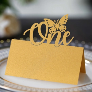 Golden glitter butterfly place card for first birthday party table seating