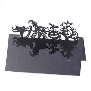 Laser cut Halloween place cards featuring black castle witch and pumpkin silhouettes