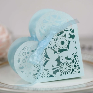 Detailed laser-cut butterfly patterns on light blue heart wedding favor box
