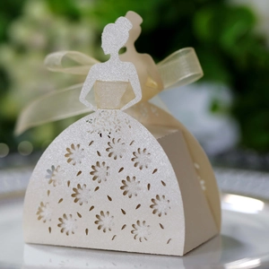 Close-up of laser-cut lace floral pattern on elegant bridal gown silhouette candy box