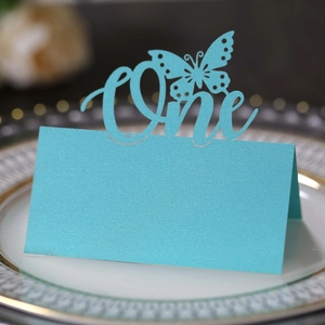 Light blue pearlescent butterfly place card with One cutout for first birthday parties