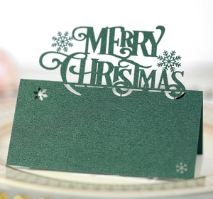 Laser cut dark green Christmas place cards with snowflake and Merry Christmas hollow design