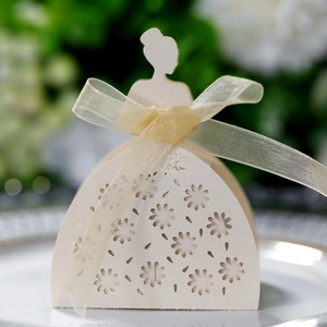 Detail of laser cut flower pattern on off-white pearl paper bridal candy gift box