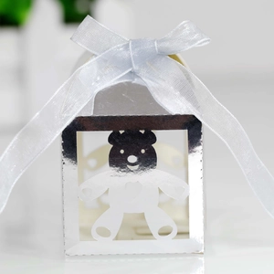 Detailed view of silver hollow bear candy box with an elegant silk ribbon bow