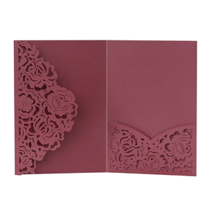 Detail of laser-cut burgundy rose floral pattern on high-quality wedding invitation cover