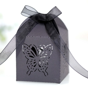 Elegant black laser cut butterfly gift box with translucent ribbon bow for weddings