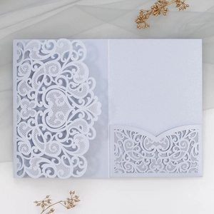 Detailed laser-cut lavender wedding invitation cover with elegant pearl finish texture