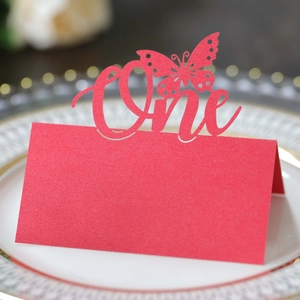 Detail view of red butterfly hollow placeholder card with One laser-cut design