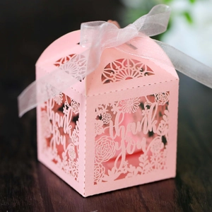 Detailed laser-cut pink gift box with floral patterns and thank you text with ribbon