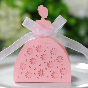 Detailed laser-cut pink wedding favor box featuring a bride silhouette and elegant ribbon