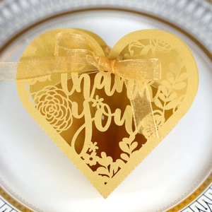 Detailed laser-cut heart gift box with floral patterns and Thank You text in gold