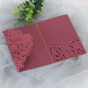 Close-up of burgundy laser-cut rose hollow pocket for wedding invitation cards