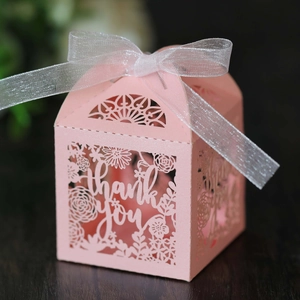 Pink laser-cut thank you gift box with floral patterns and white organza ribbon