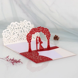 Detailed laser-cut 3D wedding invitation with glitter red gate and floral rose arch