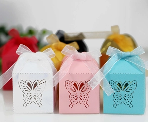 Close-up of laser-cut butterfly candy box with elegant organza ribbon detail