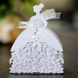 Detailed close-up of white laser-cut bridal gown gift box with elegant floral patterns
