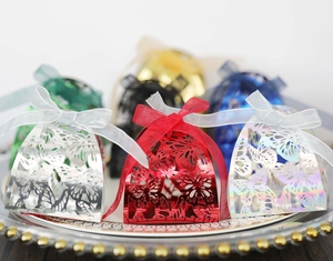 Detailed laser-cut butterfly gift boxes with silk ribbons for weddings in various colors