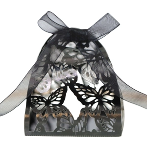 Elegant black laser-cut gift box with butterfly patterns and black organza bow ribbon