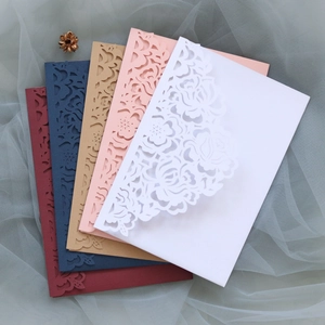 Detail showing laser cut floral hollow design on luxury wedding invitation envelopes