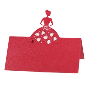 Laser cut red wedding place card with elegant gown silhouette and floral details