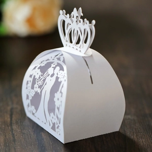 Detailed laser-cut white wedding favor box featuring a crown top and romantic silhouette