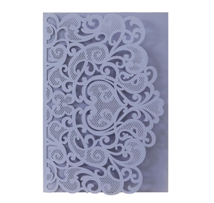 Intricate laser-cut lilac wedding invitation cover with floral patterns and a heart motif