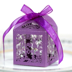 Macro detail of purple laser-cut Thank You gift box with floral patterns and a ribbon bow