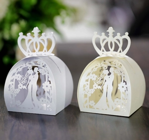 Detailed laser cut crown wedding favor box with romantic bride and groom silhouette